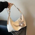 Minimalist beige hobo tote bag with adjustable shoulder strap and plush eye charm - With Pendant / White