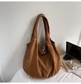 Brown suede oversized tote bag with integrated shoulder strap in a minimalist setting - One Size / Brown