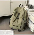 Olive green nylon backpack with drawstring front pocket and durable buckle closures - One Size / Green