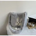 Detail of grey plush tote bag featuring cute rabbit patch and hanging leg accents - One Size / Gray
