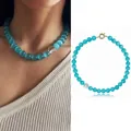 Collana di pietre naturali occhio di gatto blu da donna con chiusura in metallo dorato - Collana / 43cm / Blu Oceano