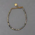 Macro detail of natural dalmatian jasper beads and golden heart charm on a beaded bracelet - Spotted Stone Marble Pattern Style (R) / 17+3cm
