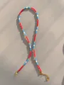 Detail of colorful beaded necklace with 18k gold plated lobster clasp and logo tag - Red Blue White Mini Style (44)