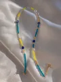Macro shot of colorful beads and freshwater pearls on gold-plated stainless steel chain - Colorful Patchwork Style (10)