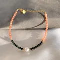 Detail of beaded bracelet with baroque pearl and 18K gold plated steel lobster clasp - Orange Green Beads with Baroque Pearl