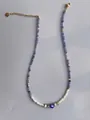 Detail of colorful beads, white pearls and blue evil eye pendant on gold-plated chain - Purple Blue Evil Eye Style (25)