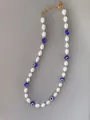 Close-up of beaded necklace with pearls, evil eye beads and 18k gold plated steel chain - Pearl Evil Eye Style (26)