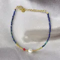 Detail of beaded bracelet with blue stone beads, white pearl and 18K gold plated chain - Deep Blue Cut Beads with Red Pearl