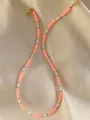 Detail of colorful gemstone beads with 18k gold spacers and lobster clasp on silk - Orange White Faceted Style (45)