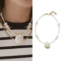 Natuurlijke zoetwaterparelketting met een grote witte spiraalvormige schelphanger - Gradiënt parel stijl / 38+5cm / Verloop