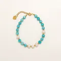 Bracelet en pierres bleues facettées avec perles blanches et charm cœur doré - Style pendentif cœur en cristal facetté bleu ciel (Bracelet 30)