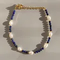 Detail of beaded bracelet with blue natural stone, baroque pearls and gold clasp - Deep Blue Cut Beads with Baroque Pearl