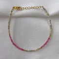 Macro detail of natural pink and grey stone beaded bracelet with 18K gold plated clasp - Pink Gray Cut Beads with Gold Spacers