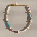 Detail of multi-color gemstone beads and natural pearls on an 18K gold plated bracelet - Purple Blue White Beads with Pearl
