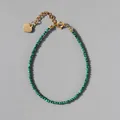 Detail of natural green stone beaded bracelet with 18k gold plated heart charm and clasp - Emerald Green
