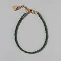 Detail view of natural green faceted bead bracelet with heart charm and 18k gold plating - Dark Green