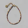 Detailed macro of colorful natural stone beads and gold heart pendant extension chain - Autumn Mix