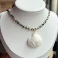 Dalmatian stone beaded necklace with white shell pendant on a jewelry display - Leopard Print Irregular Natural Stone Style (38+5cm)