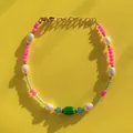 Macro view of colorful beaded bracelet with natural pearls and green glass bead center - Colorful Glass Beads Spliced Pearl Style (2)