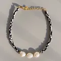 Macro view of checkered black and white beads with natural baroque pearls and gold clasp - Black White Checkerboard Baroque Pearl Style (10)