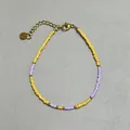 Detail view of colorful glass beads and freshwater pearl bracelet with golden clasp - Yellow Purple Seed Bead Contrast Splicing Style (16)