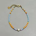 Detail of colorful bohemian beaded bracelet with freshwater pearl and gold lobster clasp - Colorful Seed Bead Center Pearl Charm Style (17)
