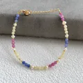 Macro detail of colorful gemstones and freshwater pearls on a gold plated bracelet - Colorful Faceted Gemstone Beads Style (10)