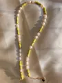 Detail of natural stone and freshwater pearl necklace on elegant champagne satin fabric - Bright Yellow Cylindrical Stone Pearl Style (10)