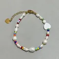 Detail of colorful glass beads and freshwater pearls bracelet with gold heart charm - Pearl Multicolor Seed Bead Big Heart Style (19)
