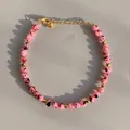 Detail of pink spotted beads and gold spacer beads on a handmade pearl bracelet - Pink Spotted Dragon Fruit Stone Style (12)