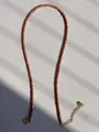 Macro view of sunstone beads and freshwater pearl necklace with adjustable gold clasp - Dark Red Goldstone Frosted Style (12)