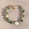 Detailed view of green natural stone beads and large baroque pearl on a gold chain - Green Phantom Chip Baroque Style (14)