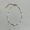 Detail of a handmade beaded bracelet with freshwater pearls and blue glass beads - White Green Blue Seed Bead Five Pearl Style (22)