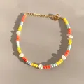 Macro shot of colorful glass beads and freshwater pearl bracelet with gold clasp - Orange Yellow Blue Seed Bead Baroque Style (23)