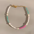 Detail of colorful beads and freshwater pearls on a gold clasp adjustable bracelet - Lake Blue Rose Red Seed Bead Pearl Style (24)