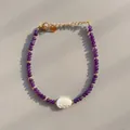 Macro detail of beaded bracelet with purple gemstones, shell leaf pendant and gold clasp - Purple Faceted Shell Leaf Style (19)