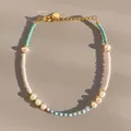 Macro detail of dopamine-style glass bead bracelet with natural freshwater pearls - Sky Blue Pink White Seed Bead Baroque Pearl Style (28)