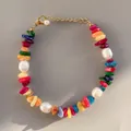 Macro shot of colorful natural stones and baroque pearls on a handmade beaded bracelet - Bohemian Colorful Chip Pearl Style (22)