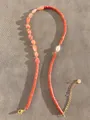 Detail of beaded necklace featuring orange natural stones and gold metal lobster clasp - Orange Red Cylinder Ore Vintage Style (21)