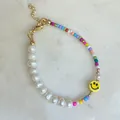 Close-up of glass bead bracelet with freshwater pearls and yellow smiley face charm - Pearl Multicolor Bead Yellow Smiley Style (34)