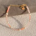 Macro shot of freshwater pearls and pink natural stones with a gold-tone lobster clasp - Pink Orange Natural Stone Pearl Style (26)