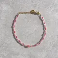 Detail of beaded bracelet with red glass beads, freshwater pearl, and gold heart charm - Red Pink Clear Seed Bead Pink Ball Heart Style (35)