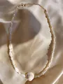 Detail of natural freshwater pearl necklace with shell pendant on champagne satin background - White Shell Spiral Pendant Bohemian Style (23)