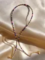 Detail of colorful faceted stones and pearls on a necklace with golden metal lobster clasp - Dark Blue Red Faceted Bead Handmade Style (26)