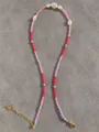 Close-up of multicolored natural stones and freshwater pearls with gold lobster clasp - Pink Red Blue Multicolor Beaded Style (30)