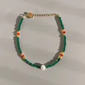 Detail of beaded bracelet with natural stones, freshwater pearl and gold clasp - Dark Green Red Yellow Faceted Collar Style (40)