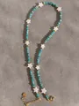 Handmade beaded necklace with blue faceted stones and white shell stars in 18k gold plating - Blue Star Spacer Style (5)