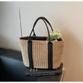 Minimalist straw tote bag featuring black woven straps and natural beige texture - Plain Style / Khaki