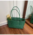 Dark green woven tote bag with cutout geometric pattern and slim dual handles - Green