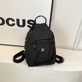 Mini mochila de nailon negro con bolsillo frontal con cremallera y logo M plateado - Talla única / Negro